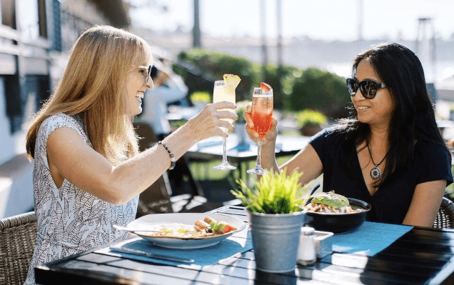 What makes coastal seafood dining experiences so popular with travellers?